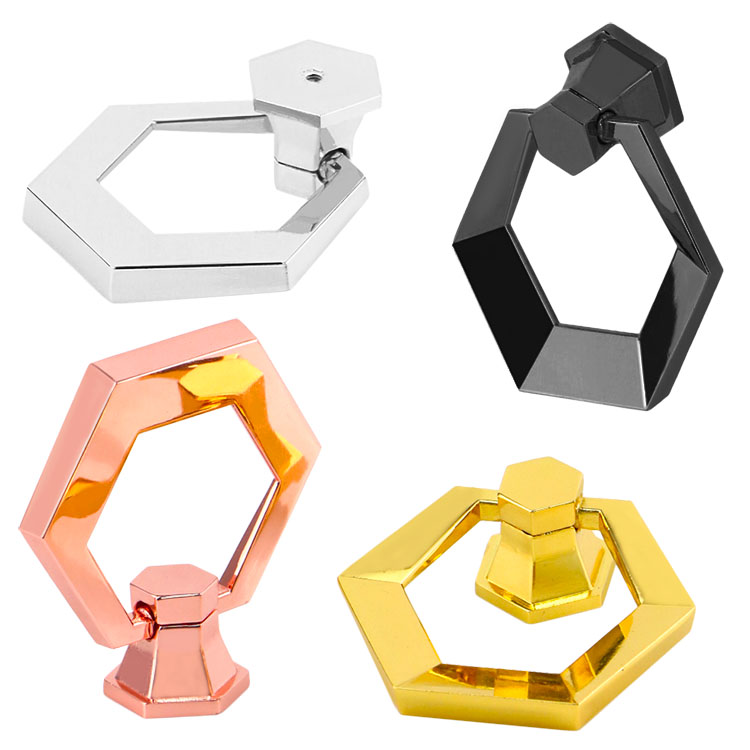 Brushed nickel and antique brass finishes on decorative furniture buttons