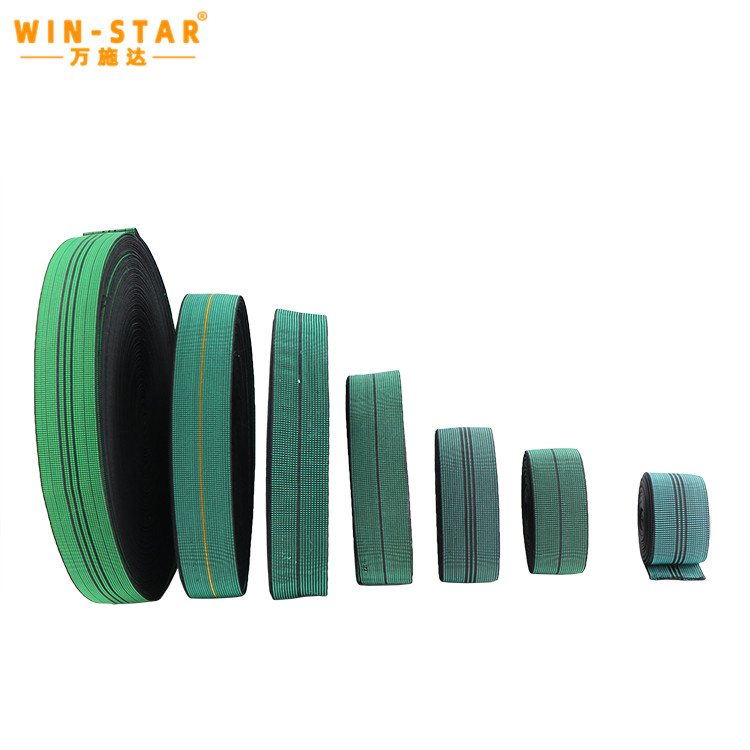 Application of green elastic webbing on a wooden sofa frame base