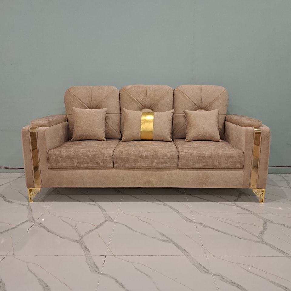 Application of metal legs on a modern European sofa